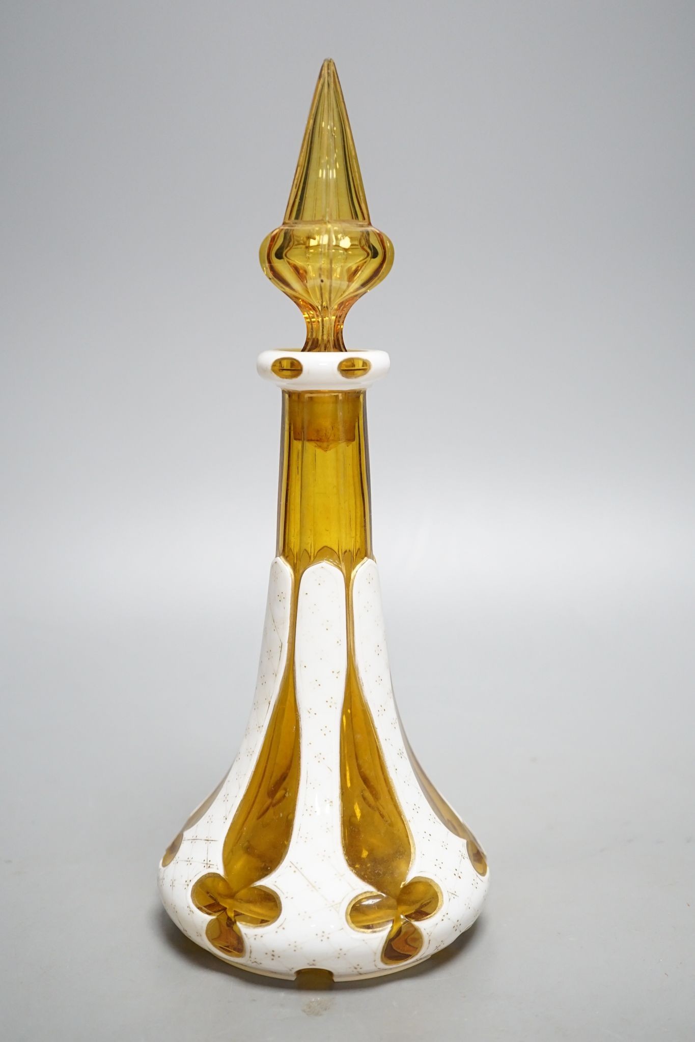A Bohemian overlaid glass scent bottle, late 19th century, 26 cms high including stopper.